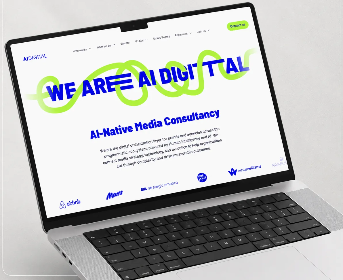 AI Digital website homepage shown on a laptop